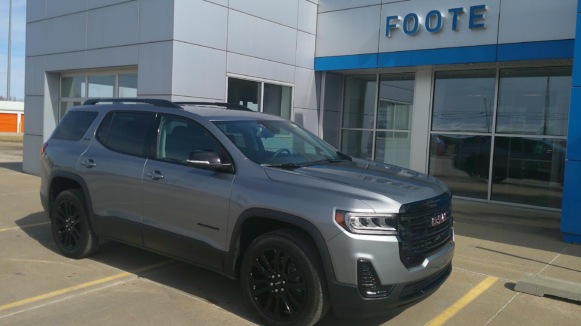 2023 GMC Acadia SLE in Sterling Metallic — front three-quarter view