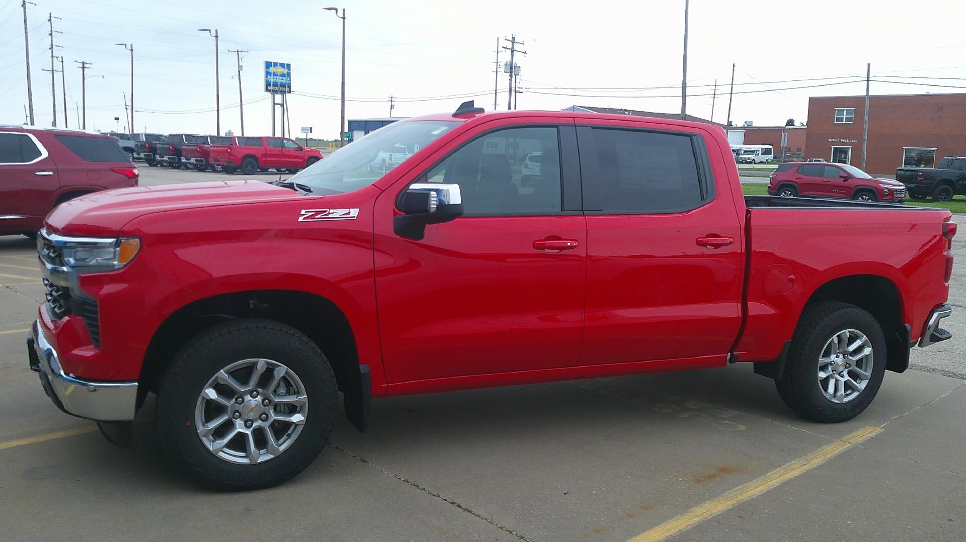 2026 Chevrolet Silverado 1500 LT in Red Hot — front three-quarter view