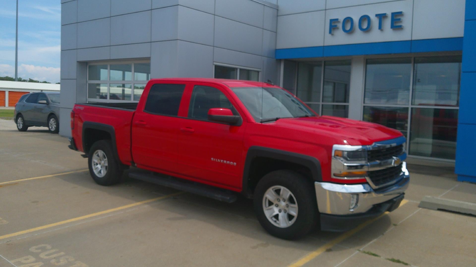 2016 Chevrolet Silverado 1500 LT in Red Hot — front three-quarter view